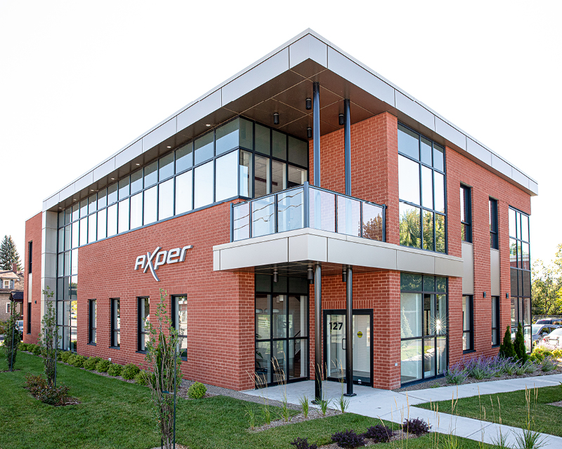 Photo de la bâtisse extérieur de Axper et la description dit que l'environnement est stimulant. Photo of the exterior of Axper building and the photo description says the environment is stimulating.